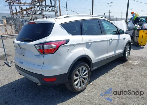 2017 Ford Escape Titanium z USA, uszkodzony, nr VIN 1FMCU0J91HUD85387